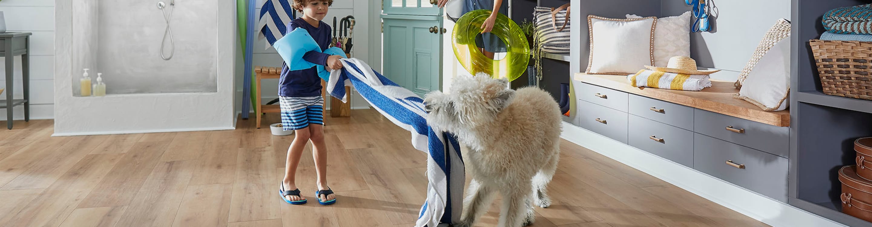 boy and dog playing on floor