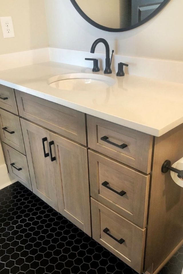 Powder room vanity update with black tile